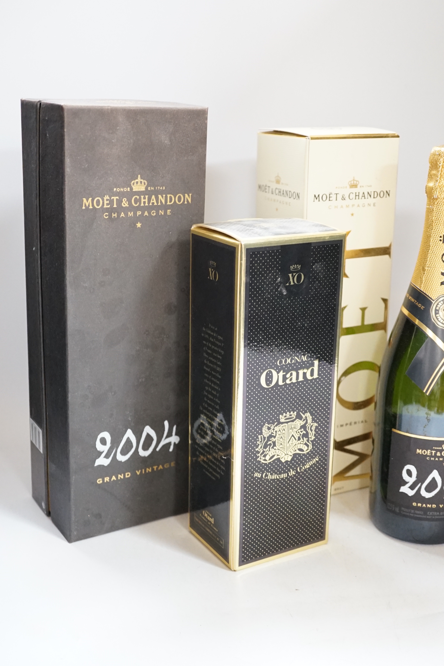 Three bottles of champagne including Moët, Otard Cognac and one other (5)